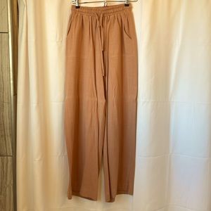 Wide leg pants, with draw strings and pockets. coral/tan color. Size small